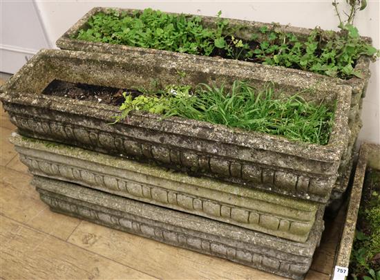 A set of six concrete garden planters, L.92cm